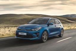 2022 Kia Rio S Hatchback driving in blue